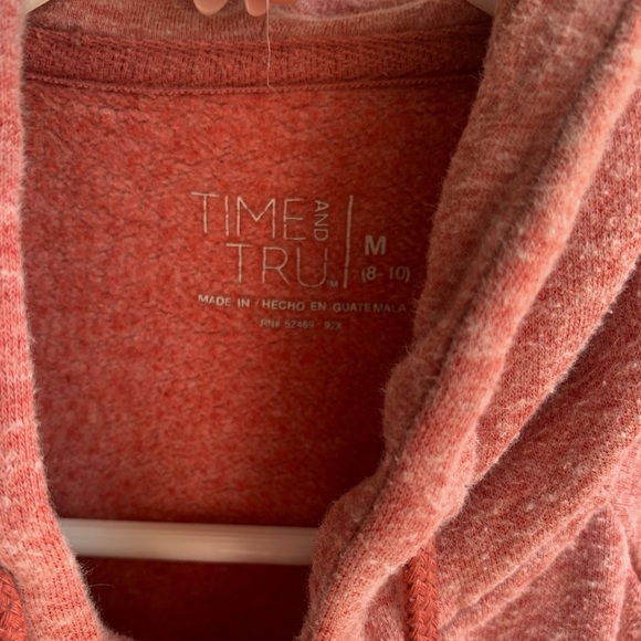 This is a light, redish jacket with a sliver zipper. - Picture 2 of 3